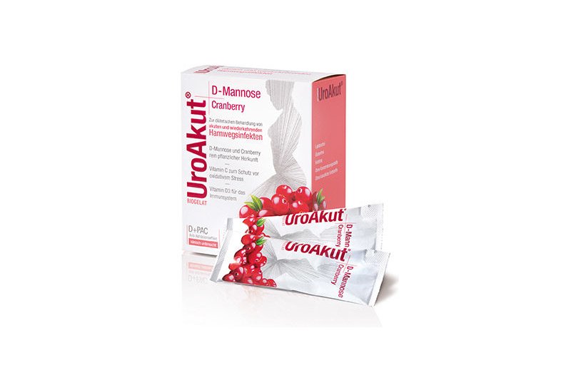 Biogelat-uroakut-dmannose-cranberry.jpg Verpackung von UroAkut mit D-Mannose und Cranberry für die Behandlung von Harnwegsinfekten, zwei stickstoffförmige Beutel sichtbar.